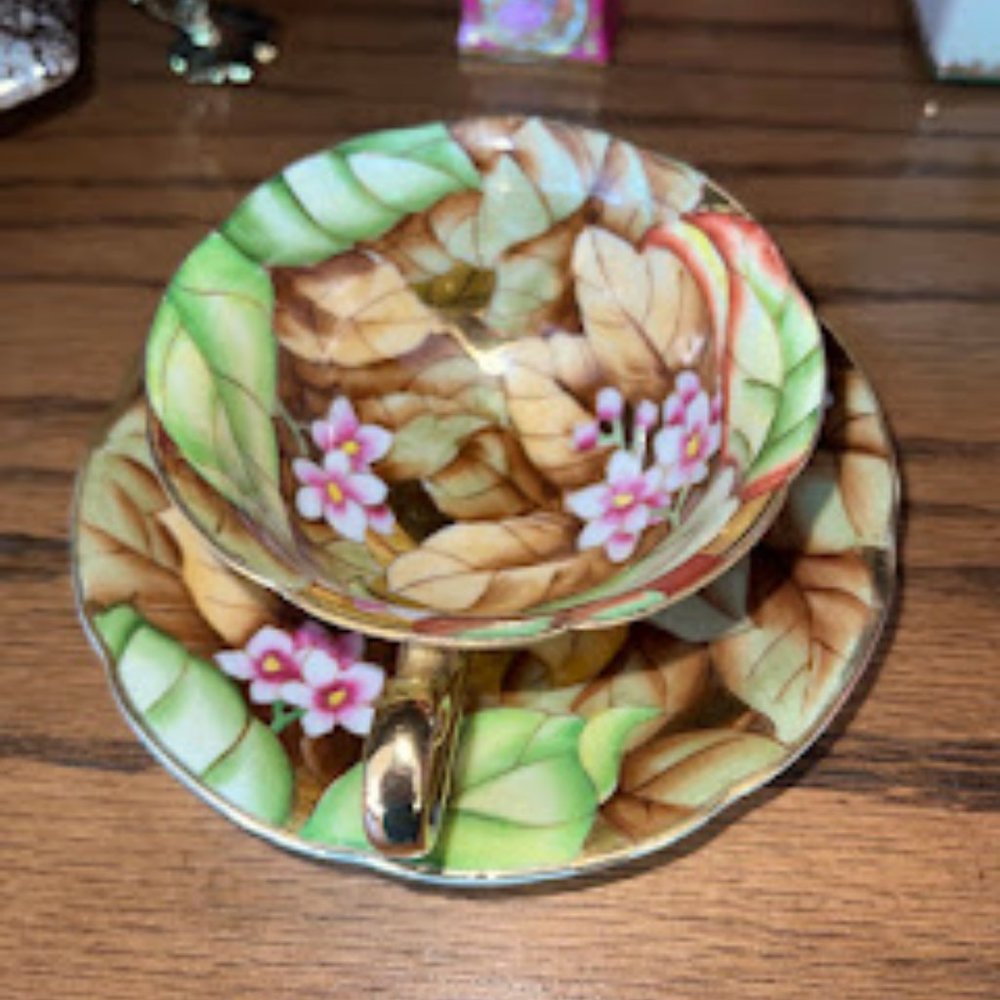 Green and brown floral teacup